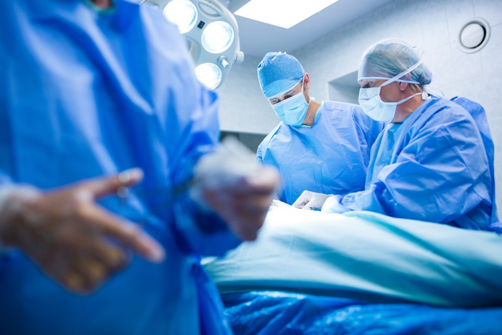 Surgeons performing operation in operation room at the hospital