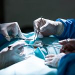 Surgeons performing operation in operation room at the hospital